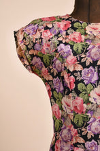 Load image into Gallery viewer, Vintage Carole Little rayon crepe floral maxi dress is shown in close up. This dress has batwing short cap sleeves. 
