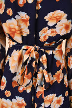 Load image into Gallery viewer, Vintage Betsey Johnson tie waist floral mini dress is shown in close up. 
