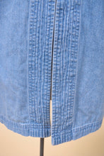 Load image into Gallery viewer, Vintage light wash blue denim top is shown in close up. 
