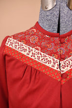 Load image into Gallery viewer, Vintage 1970&#39;s Lanz jacket is shown in close up. This bolero jacket has a patchwork paisley floral print yoke.
