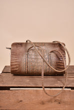 Load image into Gallery viewer, Vintage brown faux croc doctors bag is shown from the front. This bag has long straps.
