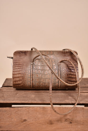 Vintage brown faux croc doctors bag is shown from the front. This bag has long straps.