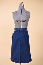 Load image into Gallery viewer, Vintage seventies dark navy denim midi length skirt is shown from the front. 
