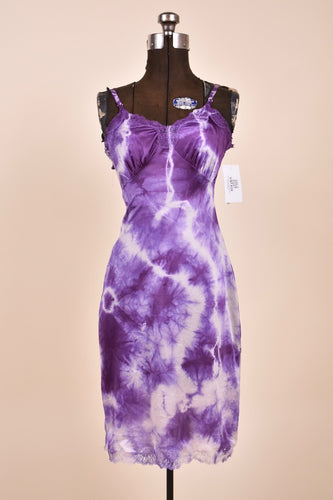 Vintage purple and white tie dye hand dyed slip dress is shown from the front. This lingerie dress is a midi length.