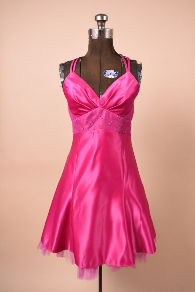 2000s vintage prom dress is shown from the front. Dress is hot pink.