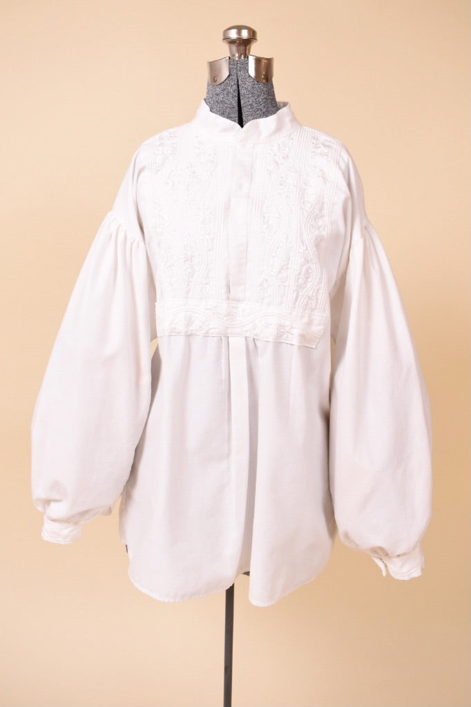 Vintage 1970s bohemian white puff sleeve blouse is shown from the front. This poet blouse has puffy sleeves. 
