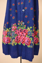 Load image into Gallery viewer, Vintage blue cotton floral print sundress is shown in close up. This dress is a midi length. 
