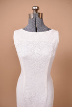 Load image into Gallery viewer, Vintage 60s white lace sleeveless mermaid dress is shown from the front. This dress has a high neckline.
