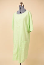 Load image into Gallery viewer, Vintage Y2K bright green linen cotton blend midi dress is shown from the side. This dress has a scoop neckline. 
