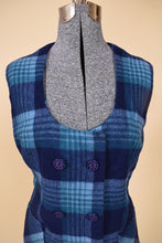 Load image into Gallery viewer, Vintage 70&#39;s blue plaid vest and skirt set is shown in close up. This set has a double breasted vest with blue buttons. 
