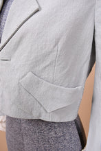 Load image into Gallery viewer, 2000&#39;s designer cropped blazer by Zac Posen is shown in close up. This jacket has a western style pocket on the bottom.
