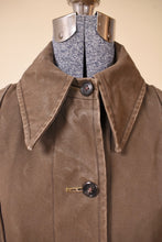 Load image into Gallery viewer, Vintage sixties waxed canvas olive green button down caplet rain jacket is shown from the front. 
