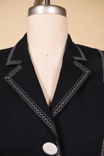 Load image into Gallery viewer, Vintage white Escada two piece blazer and trouser set is shown in close up. This set has white zig zag stitching on the lapel. 
