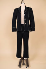 Load image into Gallery viewer, Vintage Escada two piece pantsuit with white contrast stitching is shown from the front. This western inspired suit has abalone buttons down the front. 
