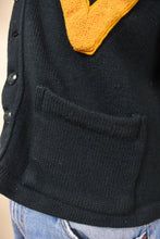 Load image into Gallery viewer, Vintage dark green University of Vermont 40&#39;s sweater is shown in close up. This sweater has two front pockets. 
