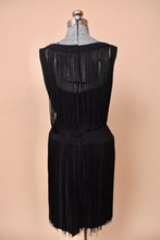 Load image into Gallery viewer, The back of the dress is seen on a mannequin.
