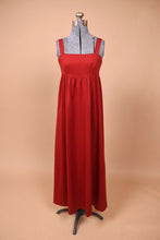 Load image into Gallery viewer, Vintage 70&#39;s red maxi dress by Lanz is shown from the front. This dress has an empire waist cut and thick tank straps.
