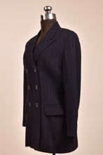 Load image into Gallery viewer, Vintage Charles Chang Lima black and white pinstripe wool blazer is shown from the side. 
