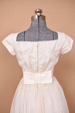 Load image into Gallery viewer, Vintage white polka dot tulle mesh ball gown is shown from behind.
