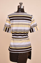 Load image into Gallery viewer, Vintage 1970s shirt is pictured from the back. The 1970&#39;s top has a belted waist.
