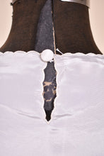 Load image into Gallery viewer, Vintage white blouse by Lamexi is shown in close up. This blouse has a scalloped hem.
