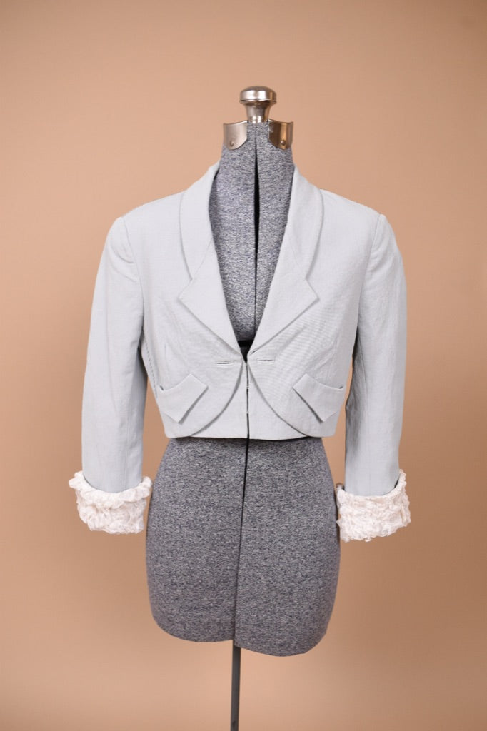 Vintage Y2K designer baby blue cropped blazer by Zac Posen is shown from the front.