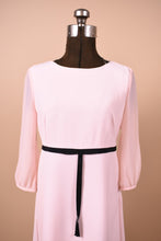 Load image into Gallery viewer, Baby pink Ted Baker mini dress is shown in close up. This dress has sheer balloon sleeves.
