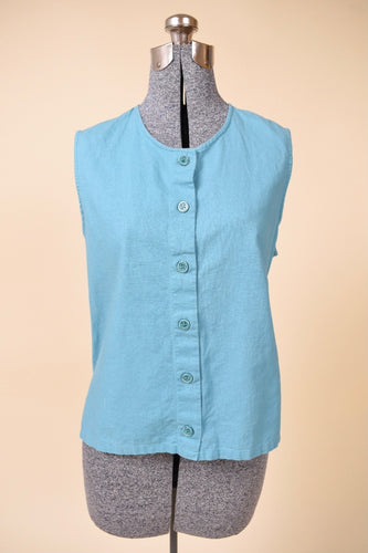 Vintage teal sleeveless cotton button up tank is shown from the front. This top has a scoop neckline.