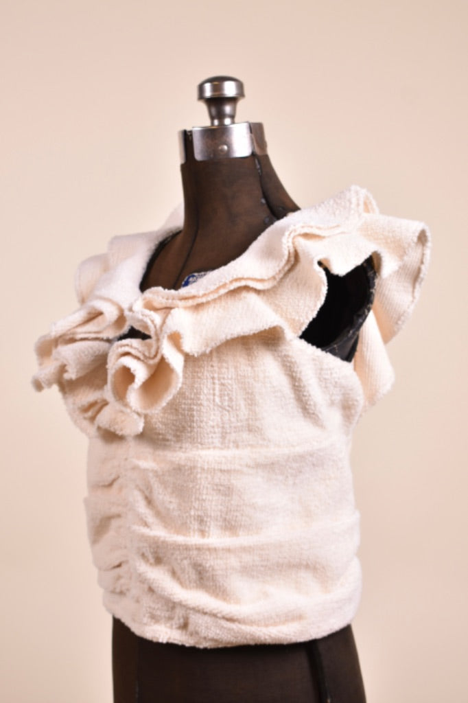 Vintage terry cloth ruffle neckline crop top is shown from the side. This shirt is new with tags by the brand Koch. 