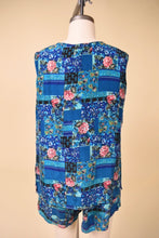 Load image into Gallery viewer, Vintage aqua blue and pink rose print patchwork set is shown from the back. 
