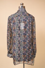 Load image into Gallery viewer, Vintage sheer printed chiffon button up collared blouse is shown from the back.
