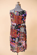 Load image into Gallery viewer, Vintage swingy patchwork print nineties mini dress by Ultimate is shown from the back. 
