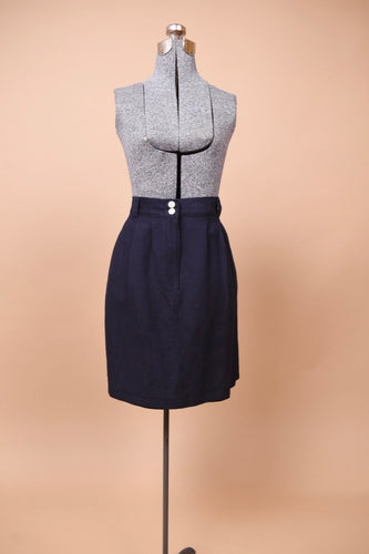 The skirt faces forward on a mannequin. The piece is midi to short length.