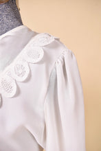 Load image into Gallery viewer, Vintage eighties puff sleeve sheer white rayon midi dress is shown in close up. This dress has a lace bib collar. 
