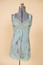 Load image into Gallery viewer, Vintage seafoam green silk floral slip is shown from the front. This slip is by the brand Harknam.
