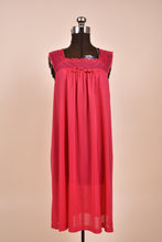Load image into Gallery viewer, Vintage hot pink square neck midi length nightgown is shown in close up. This nightgown has a bow at the neckline. 
