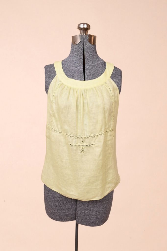 Vintage pastel yellow linen tank top by Max Studio is shown from the front. This top has a rounded scoop neckline. 