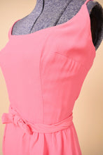 Load image into Gallery viewer, Vintage pink mini dress is shown in close up. This dress has a bow belt at the waist.
