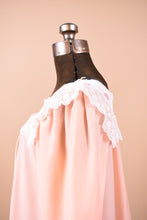 Load image into Gallery viewer, Vintage pink sleep dress shown from the side. This dress has a delicate white lacey bib collar.
