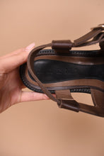 Load image into Gallery viewer, Brown leather italian made designer sandals are shown in close up. These sandals read Marni on the sole.
