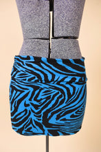 Load image into Gallery viewer, Vintage Y2K blue and black zebra print mini skirt is shown from the front. This skirt has a fold over waistband.
