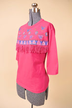 Load image into Gallery viewer, Vintage 1990s DIY bright pink tee shirt is shown from the side. This top has DIY puffy paint triangle designs across the bust.
