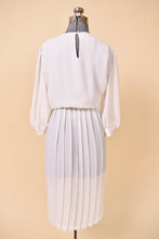 Load image into Gallery viewer, Vintage eighties white pleated skirt sheer dress is shown in close up. This dress has a keyhole at the back neckline. 

