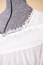Load image into Gallery viewer, Vintage white cotton and lace mini nightgown dress is shown in close up. 
