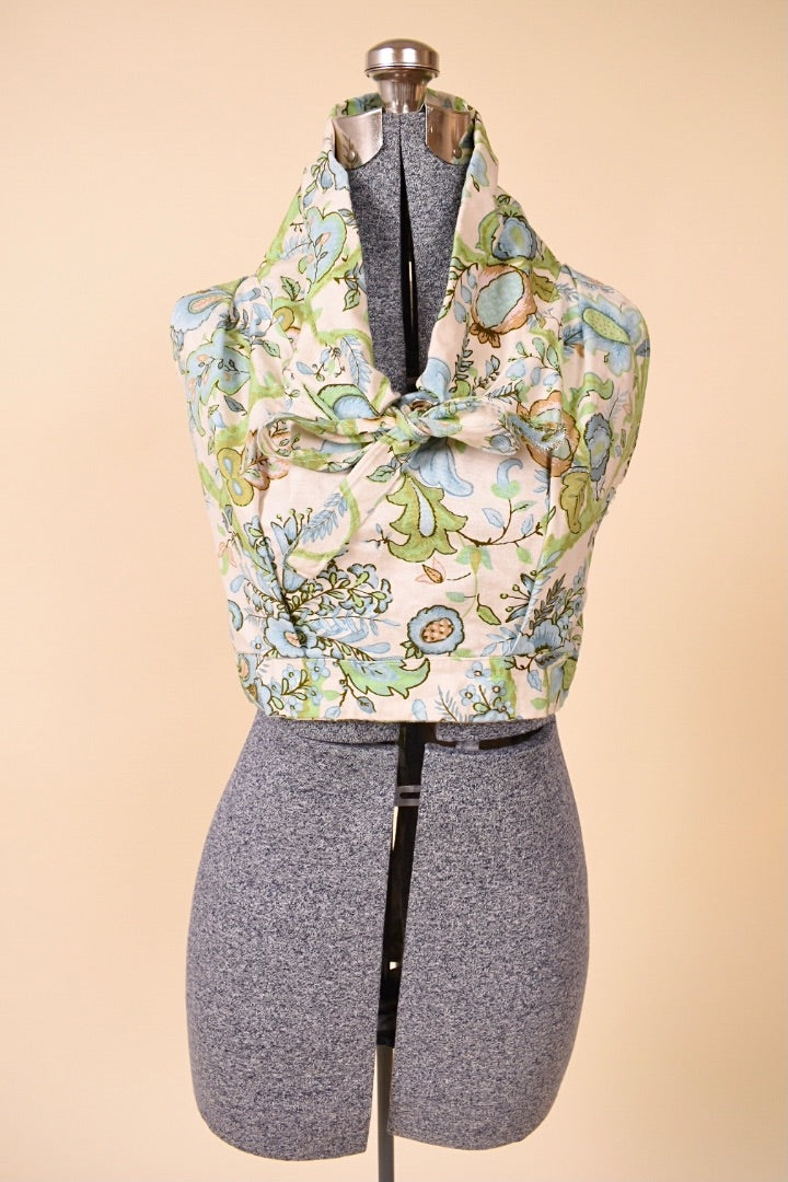 Vintage 70s handmade pastel floral crop top is shown from the front. 