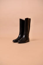 Load image into Gallery viewer, The boots are angled. They are tall and slightly reflective.
