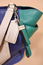 Load image into Gallery viewer, Vintage 2000&#39;s blue, green, and white leather handbag is shown in close up. 

