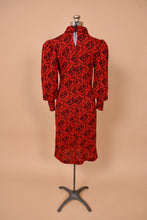 Load image into Gallery viewer, Vintage 1980&#39;s red knit dress is shown from the back. This dress has a turtleneck collar with a keyhole in the back. 
