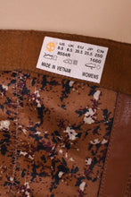 Load image into Gallery viewer, Vintage Timberland tall brown leather boots are shown in close up. These boots are tagged a size eight. 
