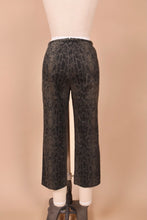 Load image into Gallery viewer, Vintage grey snakeskin print low rise cropped pants are shown from the back. These 90s capri pants are shown from the back.
